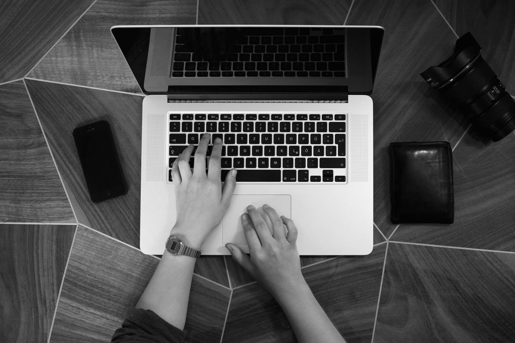 A person typing on a keyboard: view from above.